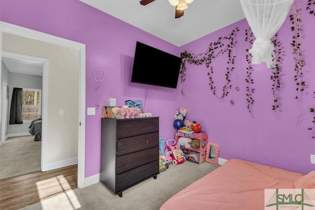 carpeted bedroom featuring ceiling fan