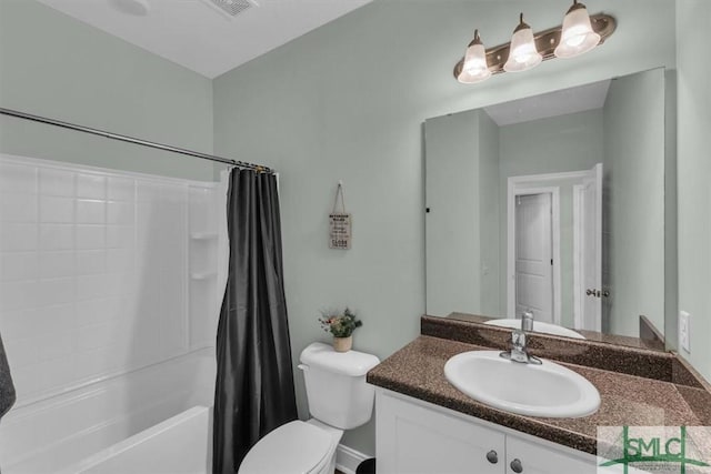 full bathroom featuring shower / bath combo, vanity, and toilet