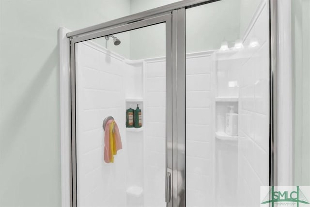 room details featuring a shower with door