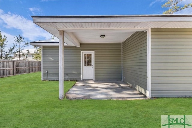 doorway to property featuring a yard and a patio