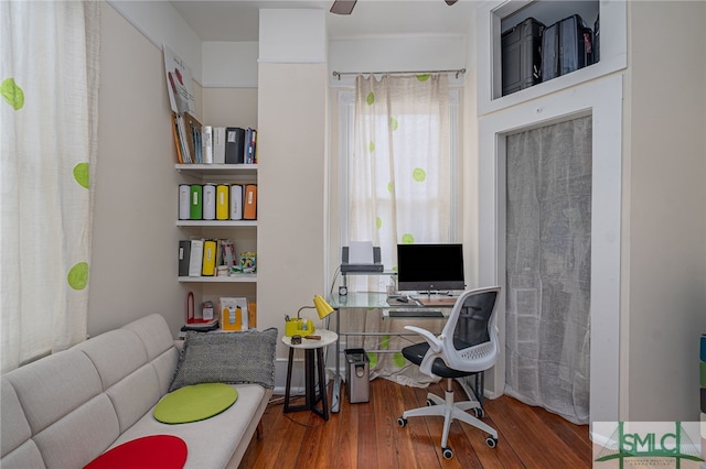 home office featuring hardwood / wood-style flooring and ceiling fan