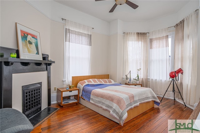 bedroom featuring hardwood / wood-style flooring and ceiling fan