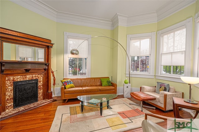 524 E Henry St, Savannah, GA 31401 - living area featuring wood finished floors, crown molding, and a fireplace