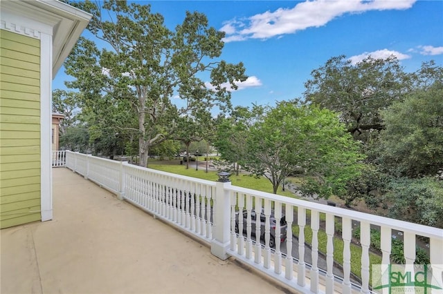 524 E Henry St, Savannah, GA 31401 - view of patio / terrace featuring a balcony and view of wooded area