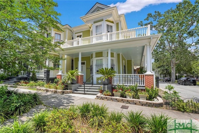 view of front facade with a porch and a balcony