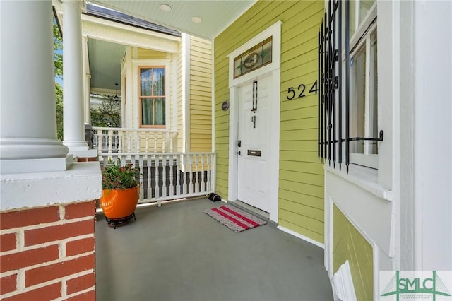 entrance to property featuring covered porch