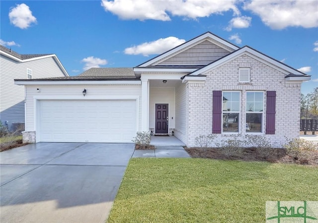 view of front of property with a garage and a front yard