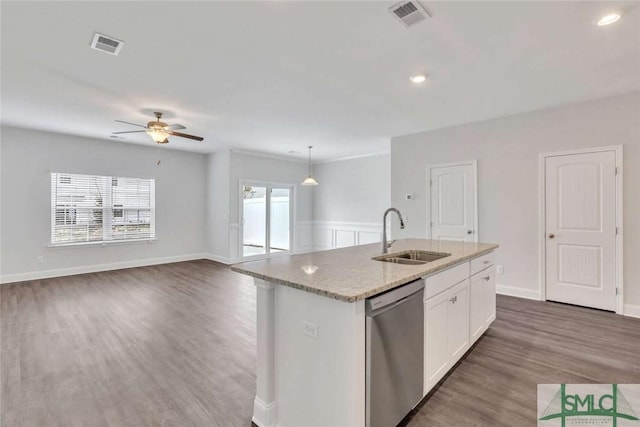 kitchen featuring sink, white cabinetry, an island with sink, decorative light fixtures, and stainless steel dishwasher