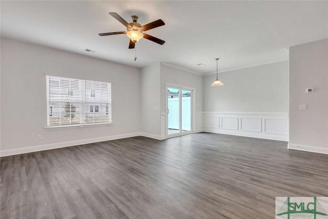 unfurnished room featuring ceiling fan and dark hardwood / wood-style flooring