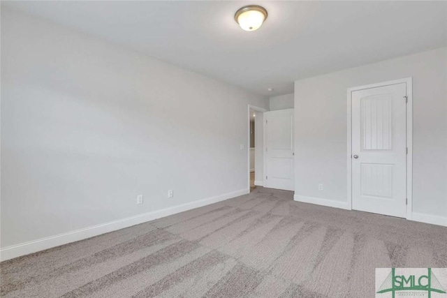 unfurnished bedroom with carpet floors and a closet