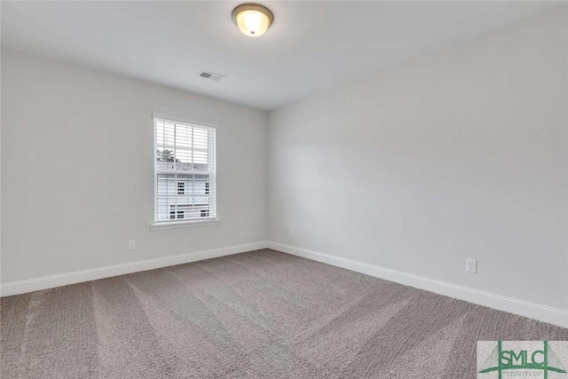 unfurnished room featuring carpet