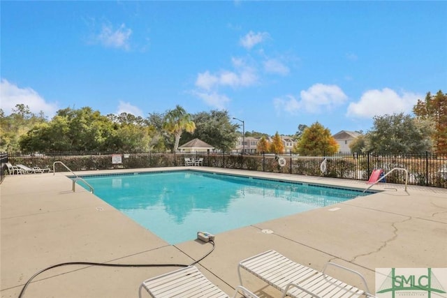 view of swimming pool featuring a patio area