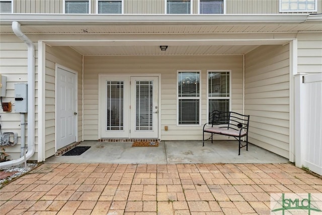 doorway to property featuring a patio area