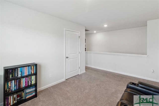 sitting room with light colored carpet