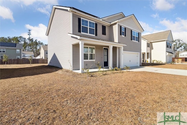 view of front of house with a garage and covered porch