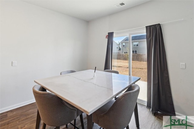 dining room featuring wood-type flooring