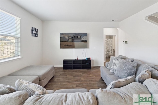 living room with dark hardwood / wood-style flooring