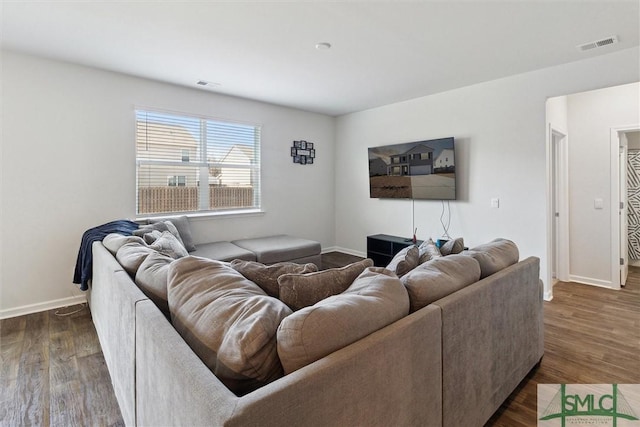 living room featuring dark wood-type flooring