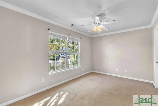 carpeted empty room featuring ornamental molding and ceiling fan