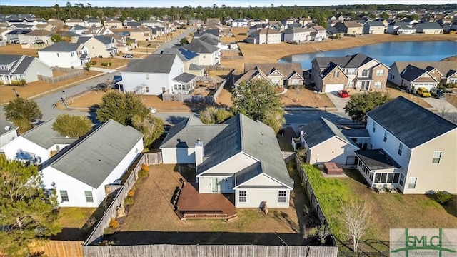 bird's eye view featuring a residential view and a water view
