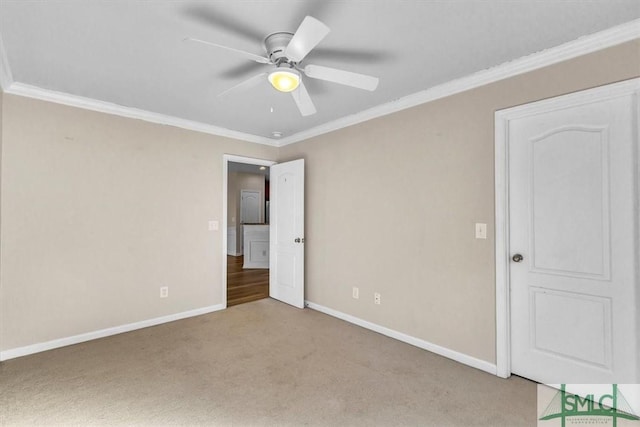 unfurnished bedroom with ceiling fan, ornamental molding, and light colored carpet