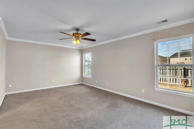 carpeted spare room with crown molding and ceiling fan