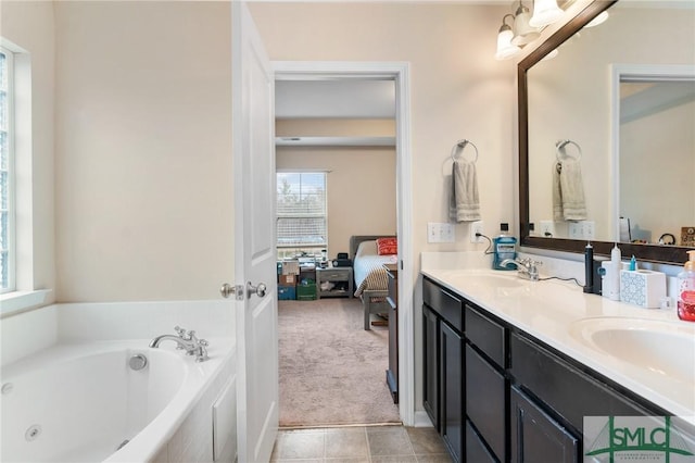 bathroom featuring vanity and a tub