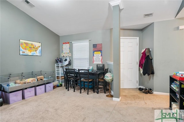 home office with light carpet and lofted ceiling