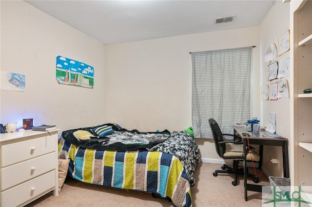 bedroom with light colored carpet