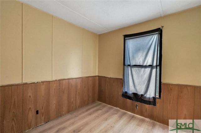 spare room with light hardwood / wood-style flooring