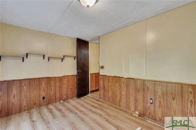 spare room with light wood-type flooring