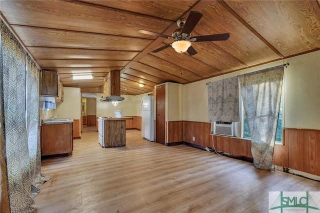 unfurnished living room with ceiling fan, cooling unit, vaulted ceiling, wooden ceiling, and light wood-type flooring