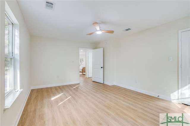 empty room featuring ceiling fan and light wood-type flooring