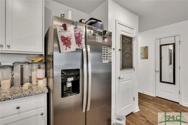 176 Coneflower Rd, Bloomingdale, GA 31302 - kitchen featuring white cabinetry, light stone countertops, wood-type flooring, and stainless steel fridge