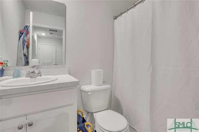 176 Coneflower Rd, Bloomingdale, GA 31302 - bathroom featuring vanity and toilet