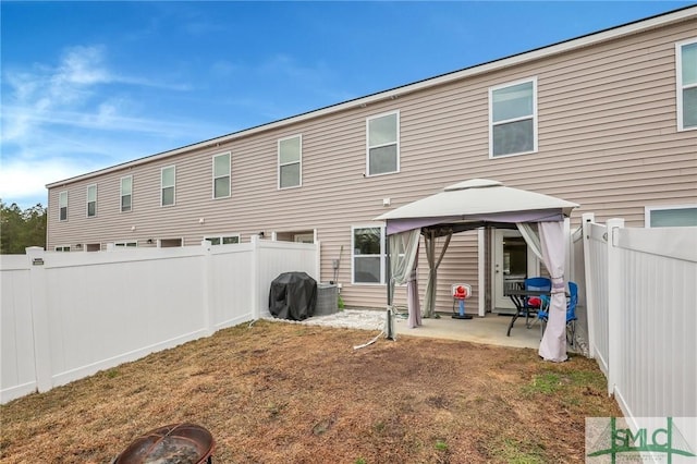 176 Coneflower Rd, Bloomingdale, GA 31302 - rear view of property featuring a gazebo, a patio, and an outdoor fire pit