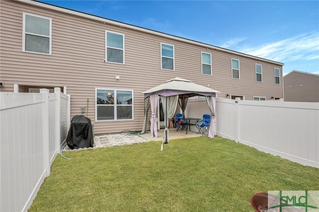 176 Coneflower Rd, Bloomingdale, GA 31302 - back of property with a gazebo, a lawn, and a patio