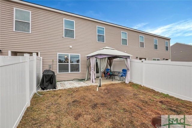 176 Coneflower Rd, Bloomingdale, GA 31302 - back of house with a gazebo, a patio, and a lawn