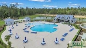 176 Coneflower Rd, Bloomingdale, GA 31302 - view of swimming pool featuring a patio area and a water view
