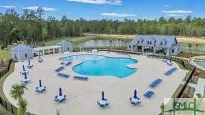 176 Coneflower Rd, Bloomingdale, GA 31302 - view of swimming pool featuring a water view and a patio