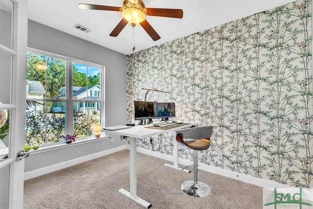 office area featuring ceiling fan, plenty of natural light, and carpet flooring