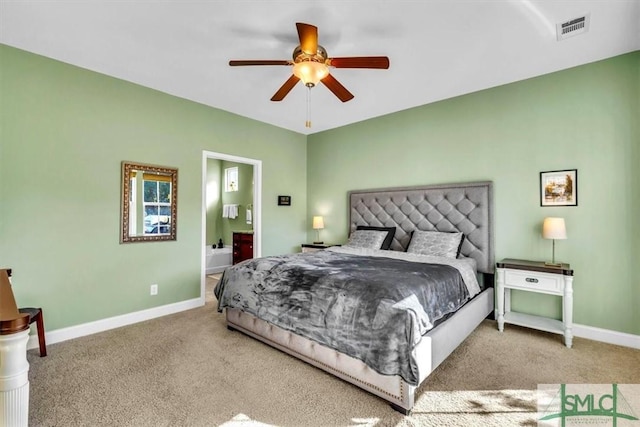 carpeted bedroom featuring ensuite bathroom and ceiling fan