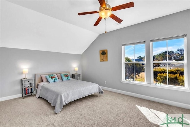 bedroom with lofted ceiling, ceiling fan, and carpet