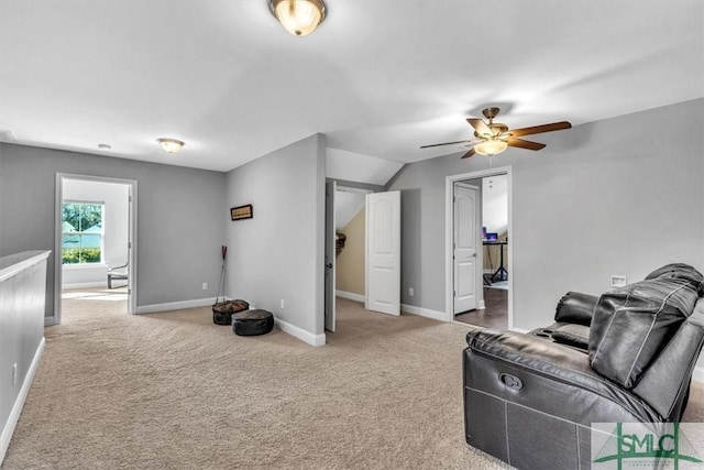 carpeted living room featuring lofted ceiling and ceiling fan