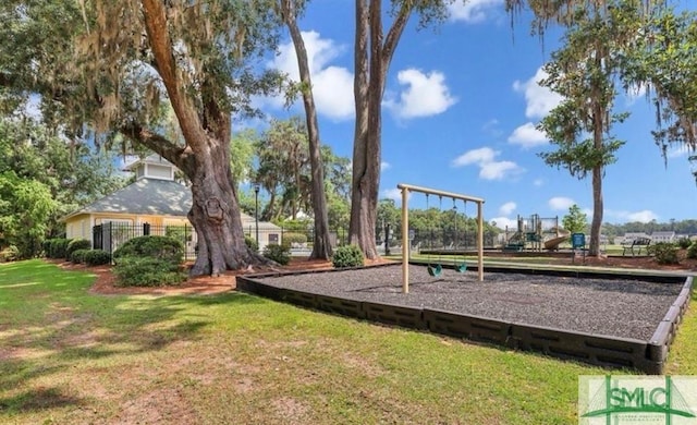 view of jungle gym featuring a lawn