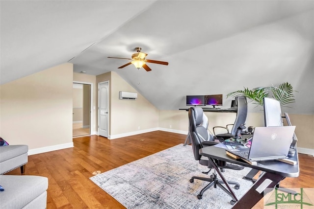 office space featuring wood-type flooring, ceiling fan, and vaulted ceiling