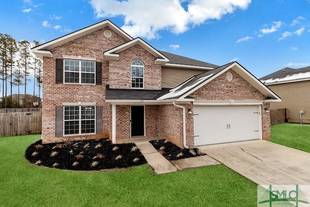 view of front of house with a garage and a front yard