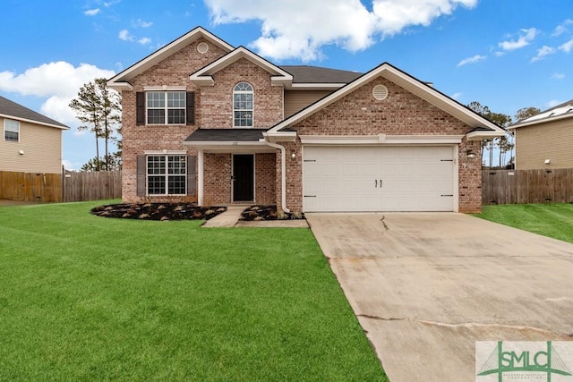 view of front of property featuring a garage and a front lawn