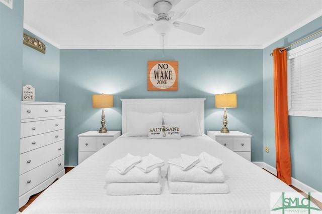 bedroom featuring baseboards, crown molding, and ceiling fan