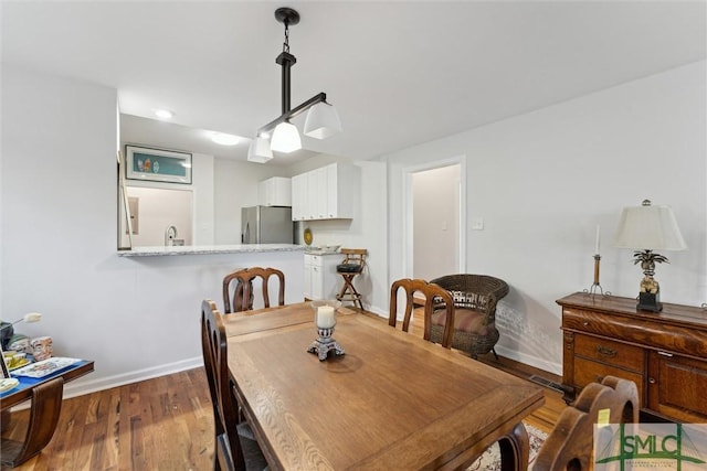 dining room featuring dark hardwood / wood-style flooring